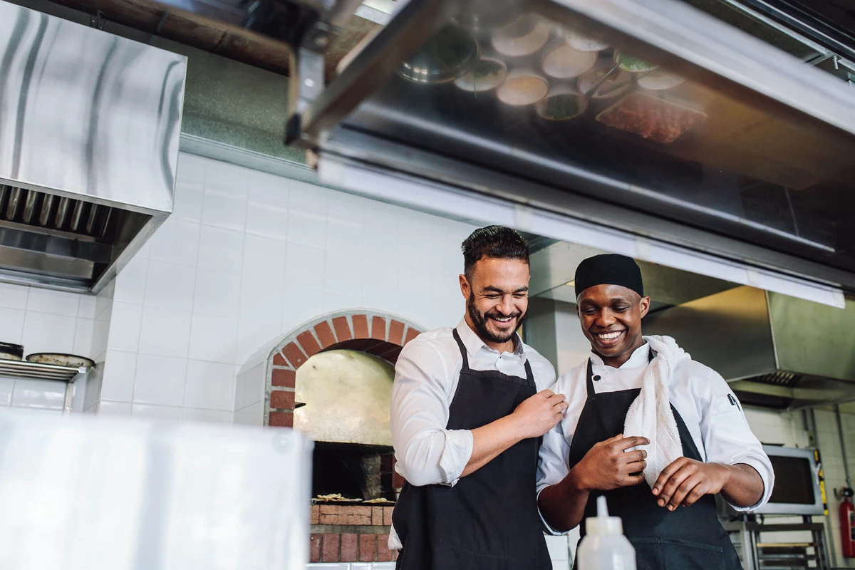 Mario and Adrian working together in the restaurant