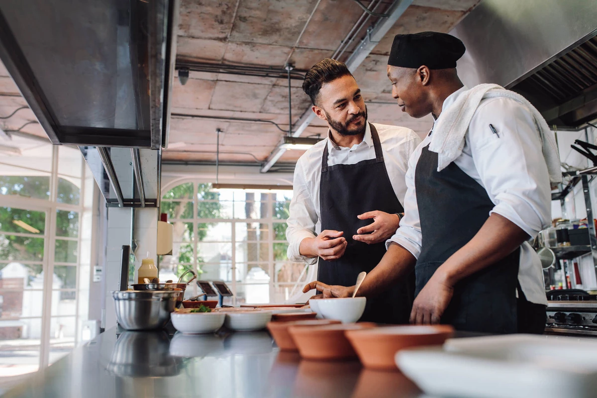 The restaurant owners preparing the dishes for the clients