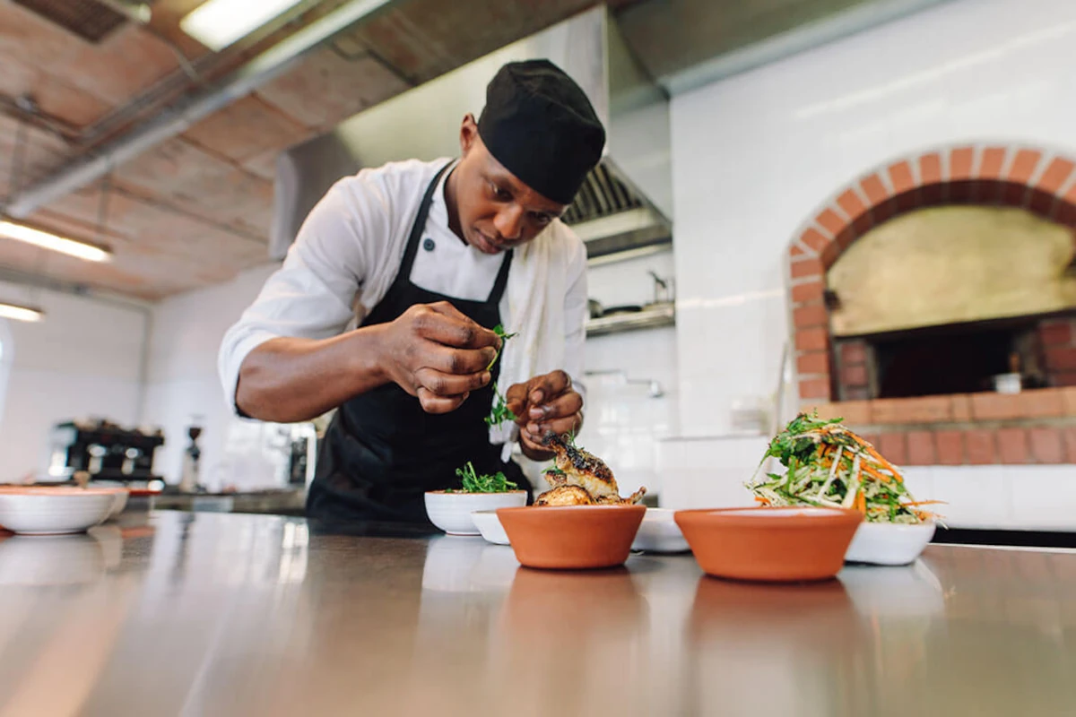 Mario preparing and arranging food in the restaurant